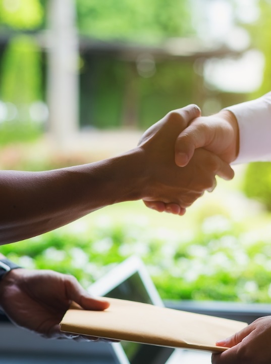a close-up of people shaking hands